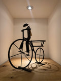 “Big-Wheeled Bike Rider Planter” by Tichoana Chinyanga