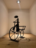 “Big-Wheeled Bike Rider Planter” by Tichoana Chinyanga